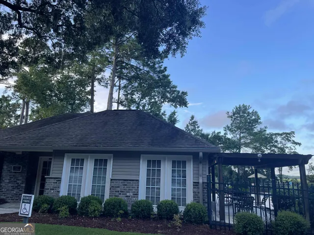 a view of outdoor space with swimming pool and seating