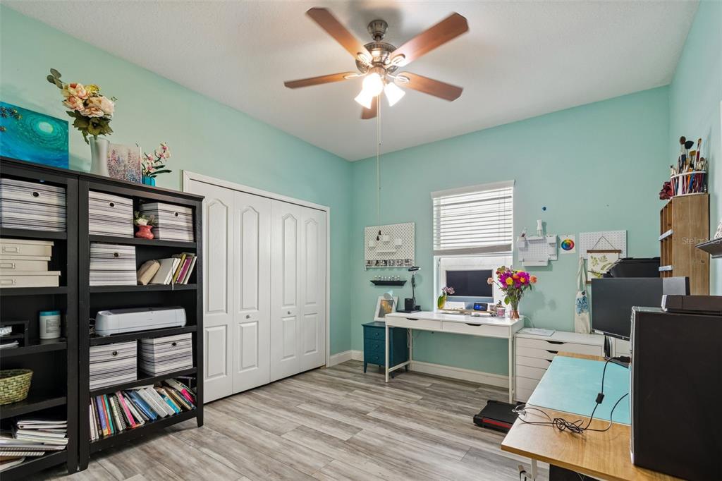 3620 Lefays Point Land O Lakes, FL 34638 - Photo 15 of 50 a workspace with furniture and a book shelf