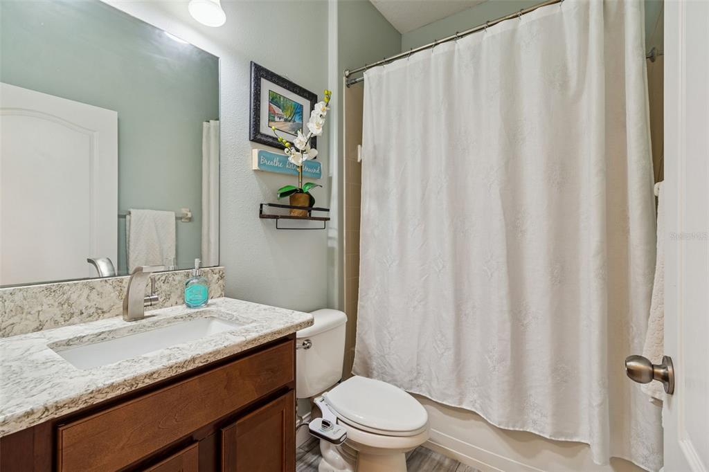 3620 Lefays Point Land O Lakes, FL 34638 - Photo 17 of 50 a bathroom with a granite countertop sink and a mirror