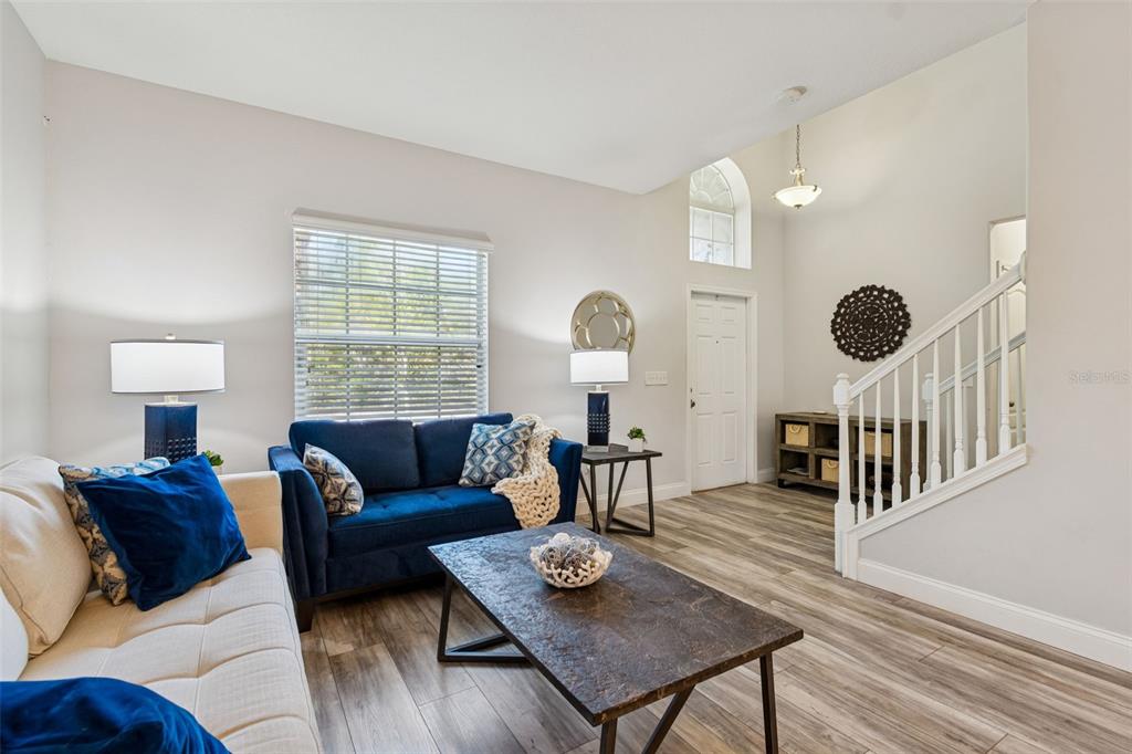 3620 Lefays Point Land O Lakes, FL 34638 - Photo 2 of 50 a living room with furniture and wooden floor