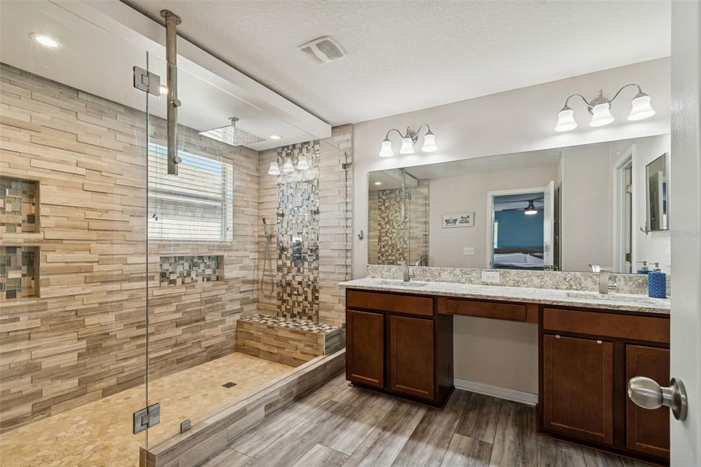 3620 Lefays Point Land O Lakes, FL 34638 - Photo 22 of 50 a bathroom with a double vanity sink mirror and shower