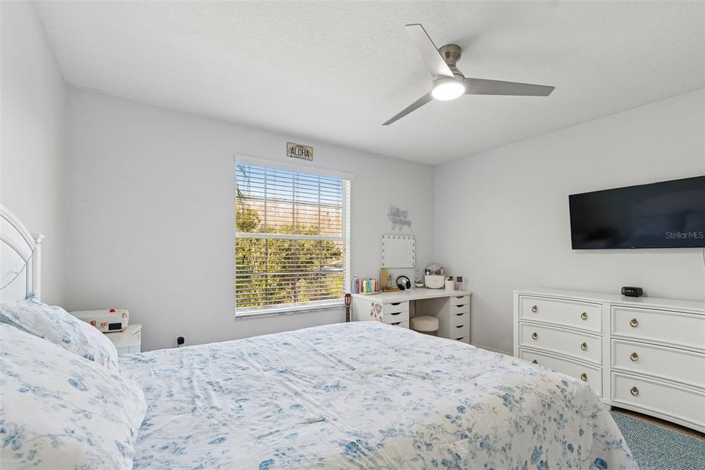 3620 Lefays Point Land O Lakes, FL 34638 - Photo 25 of 50 a bedroom with a bed and a flat screen tv