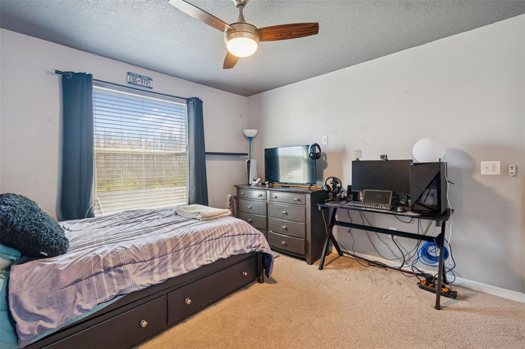 3620 Lefays Point Land O Lakes, FL 34638 - Photo 29 of 50 a bedroom with furniture and a bed