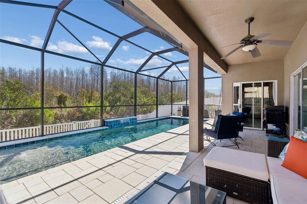 3620 Lefays Point Land O Lakes, FL 34638 - Photo 35 of 50 a living room with furniture and a floor to ceiling window