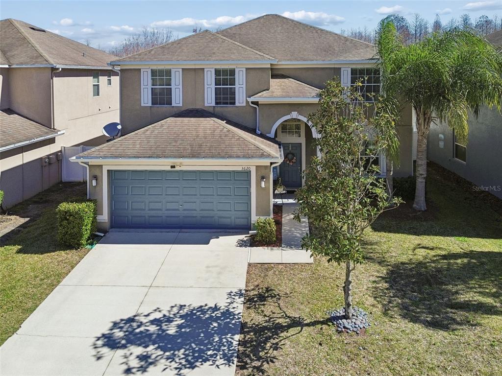 3620 Lefays Point Land O Lakes, FL 34638 - Photo 38 of 50 a front view of a house with garden