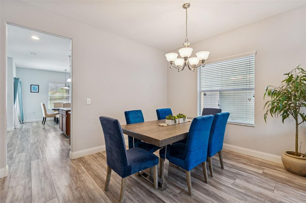 3620 Lefays Point Land O Lakes, FL 34638 - Photo 4 of 50 a view of a dining room with furniture window and wooden floor
