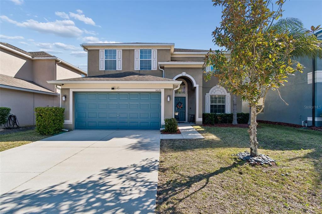 3620 Lefays Point Land O Lakes, FL 34638 - Photo 50 of 50 a front view of a house with a yard and garage