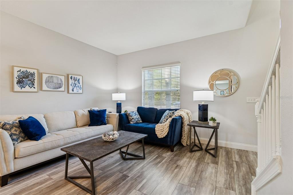 3620 Lefays Point Land O Lakes, FL 34638 - Photo 6 of 50 a living room with furniture a window and a clock