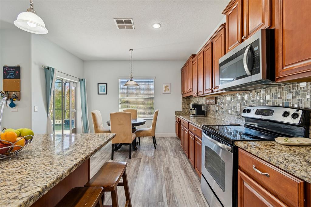 3620 Lefays Point Land O Lakes, FL 34638 - Photo 7 of 50 a kitchen with granite countertop lots of counter top space
