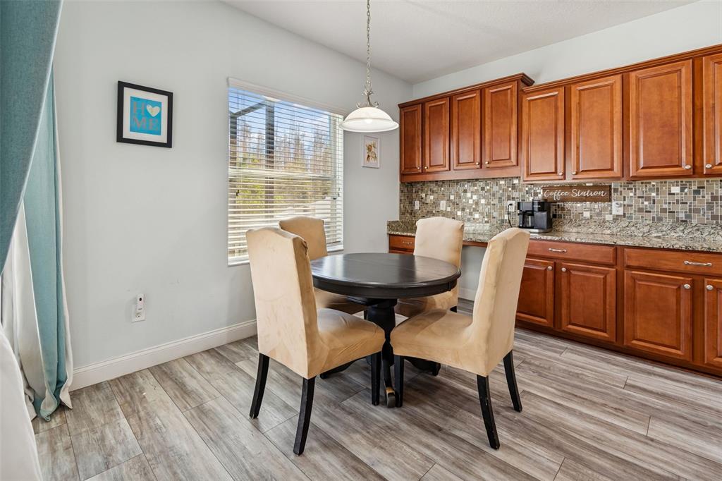 3620 Lefays Point Land O Lakes, FL 34638 - Photo 9 of 50 a view of a dining room with furniture window and wooden floor