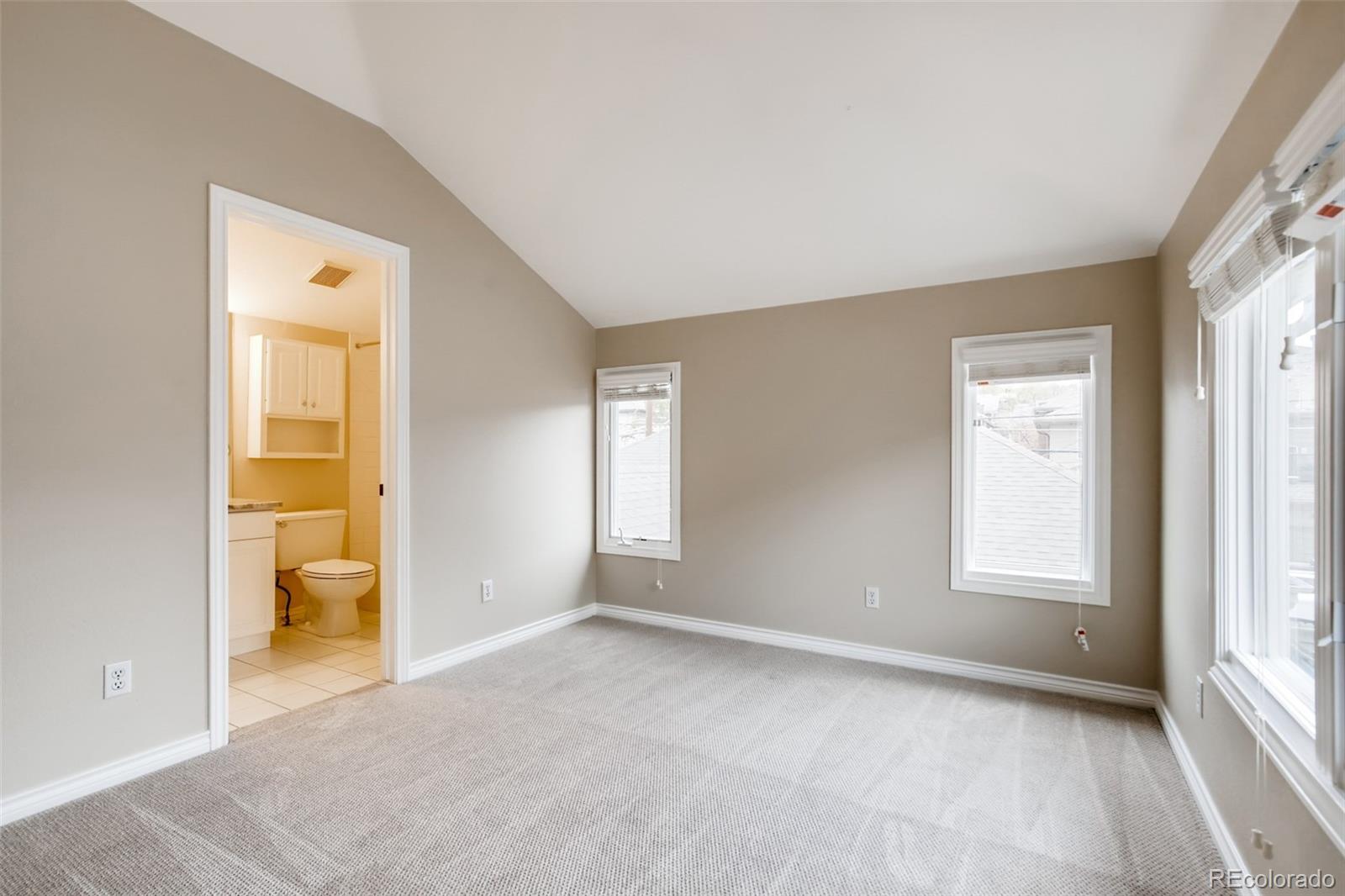 210 Cook Street Denver, CO 80206 - Photo 21 of 34 an empty room with windows and closet