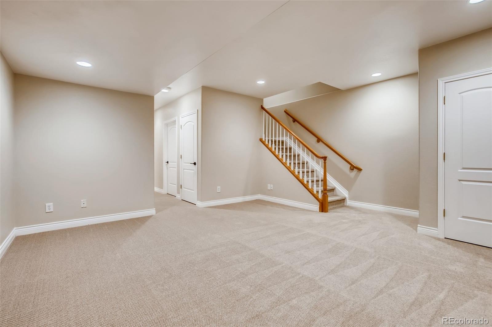 210 Cook Street Denver, CO 80206 - Photo 23 of 34 a view of an empty room with staircase