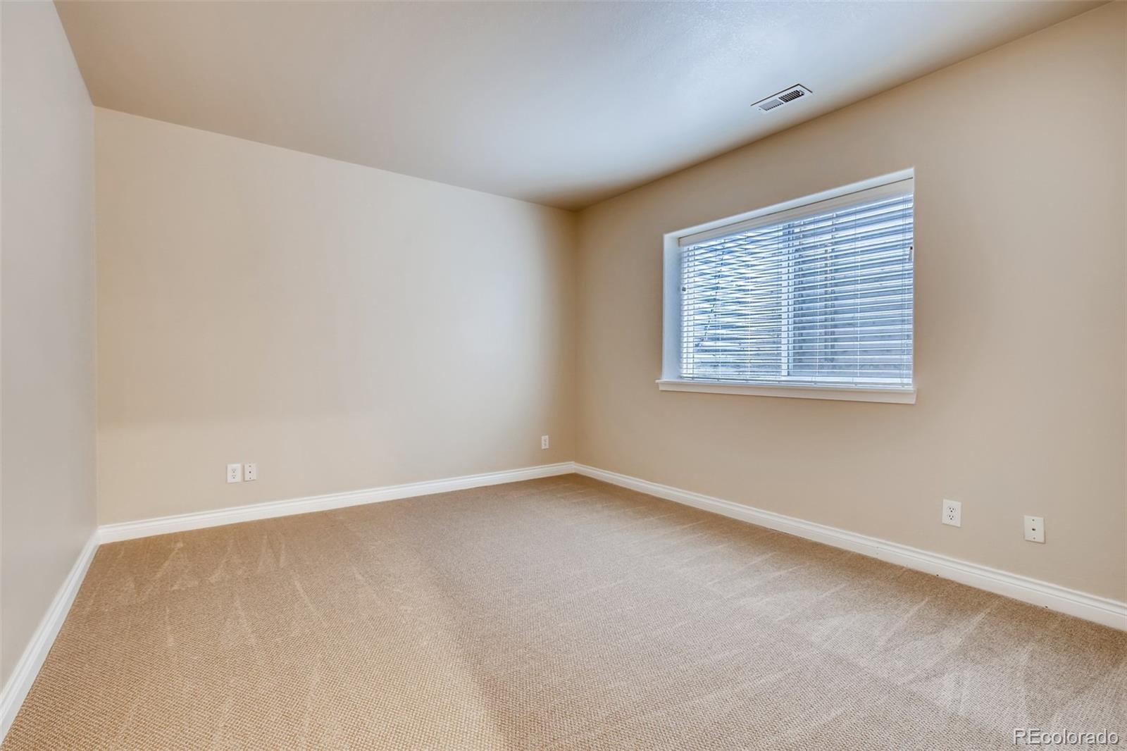 210 Cook Street Denver, CO 80206 - Photo 24 of 34 an empty room with a window