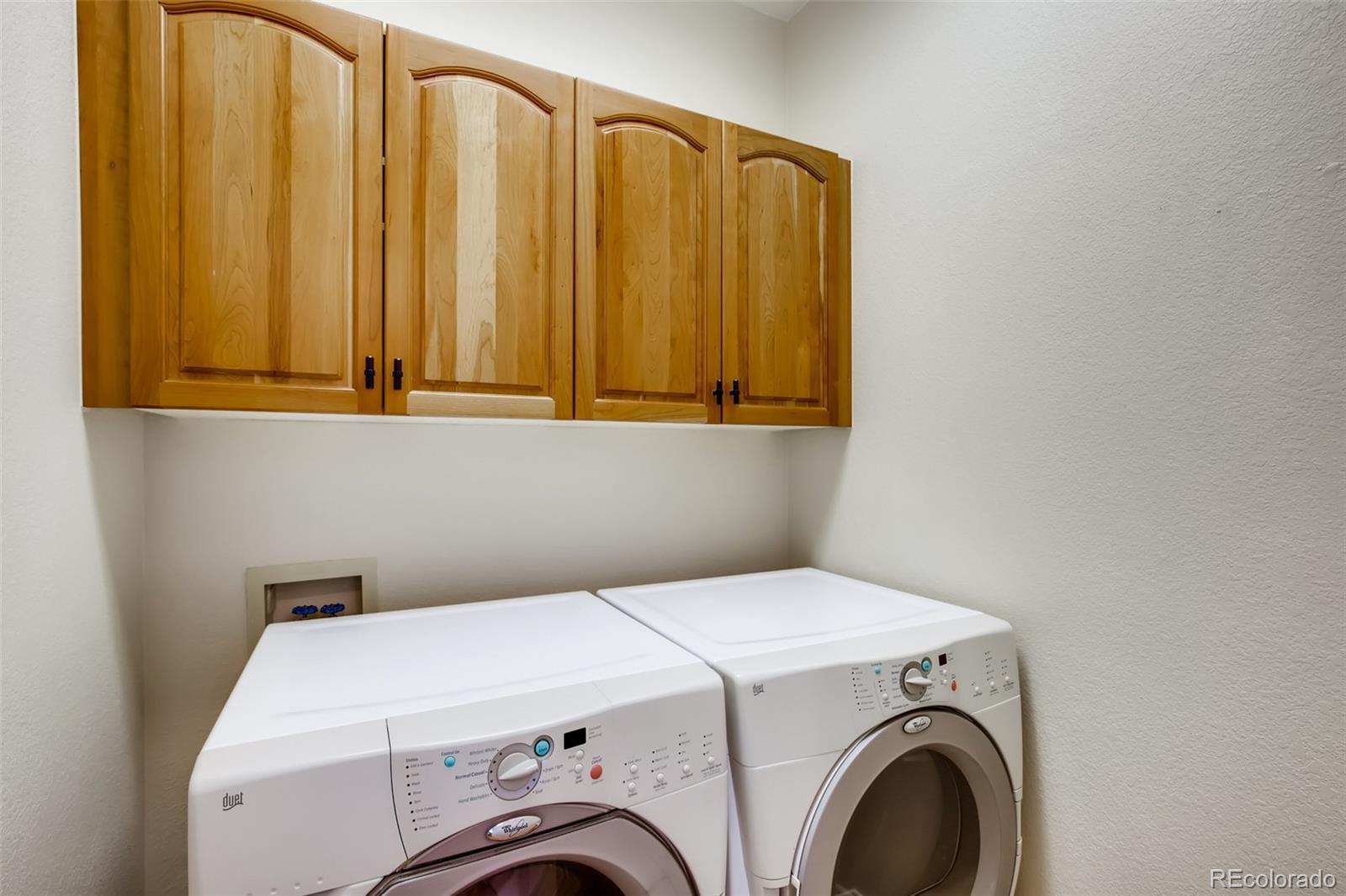 210 Cook Street Denver, CO 80206 - Photo 26 of 34 a utility room with dryer and washer