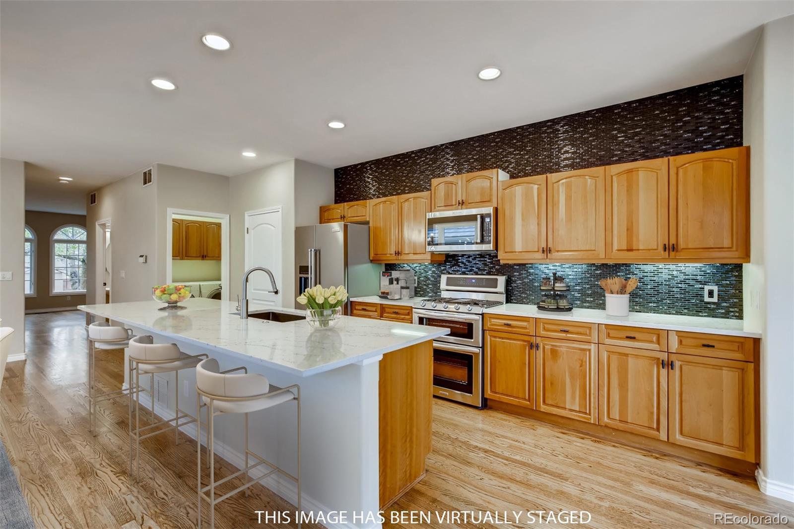 210 Cook Street Denver, CO 80206 - Photo 4 of 34 a large kitchen with granite countertop lots of counter top space