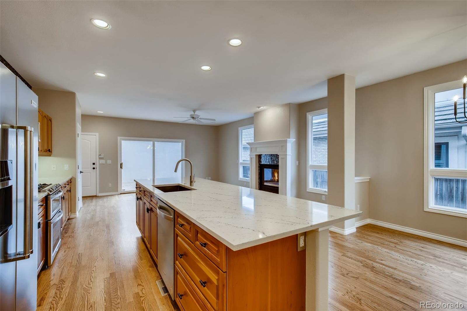 210 Cook Street Denver, CO 80206 - Photo 6 of 34 a kitchen with a stove a refrigerator and a sink