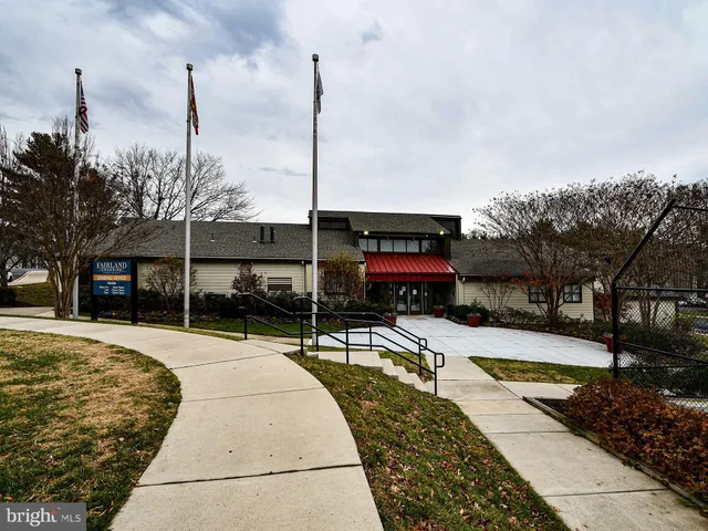 a view of a swimming pool with a patio and a yard
