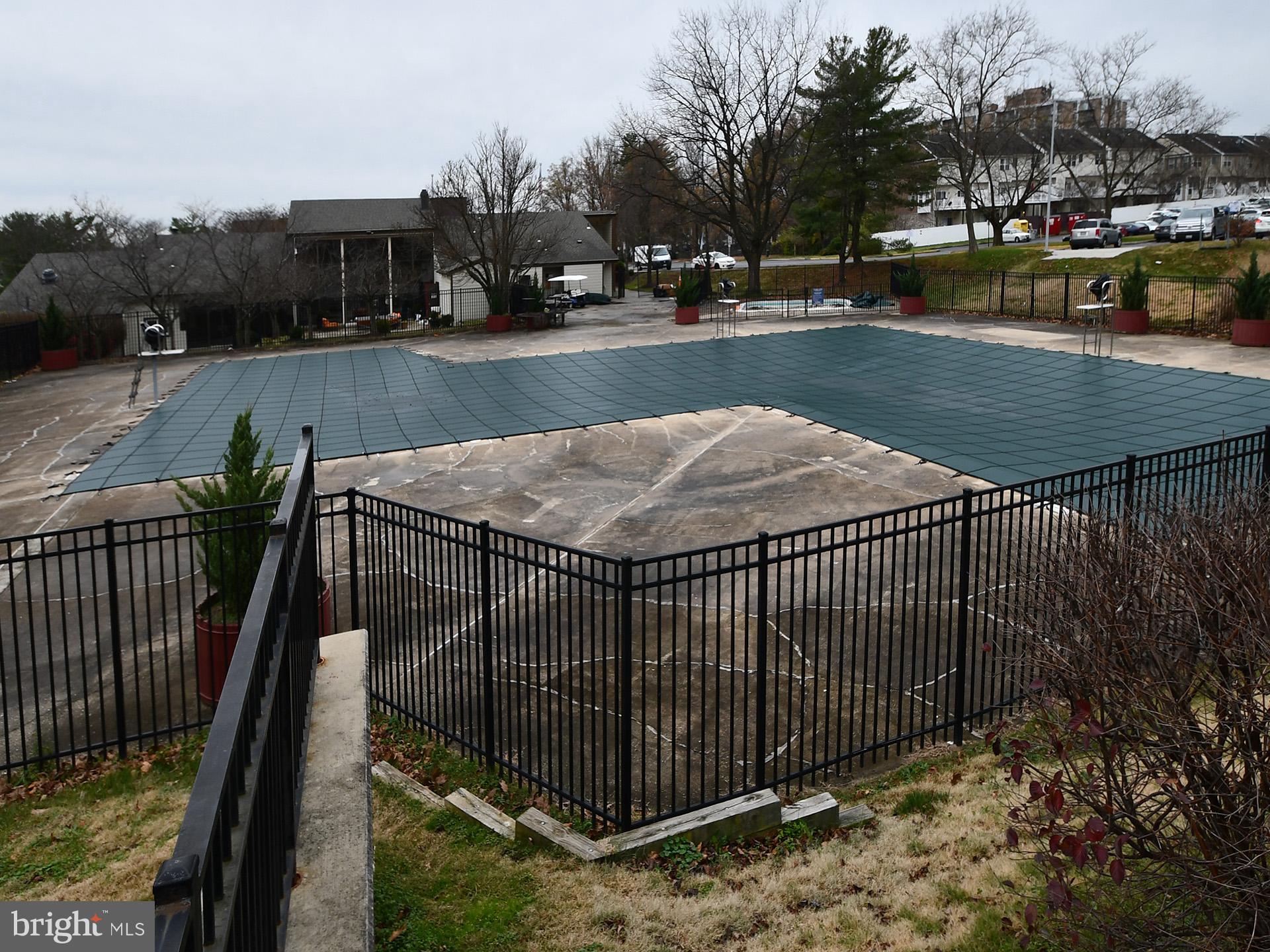 3511 Castle Way, Unit 312 Silver Spring, MD 20904 - Photo 18 of 20 a view of a swimming pool with a patio and a yard