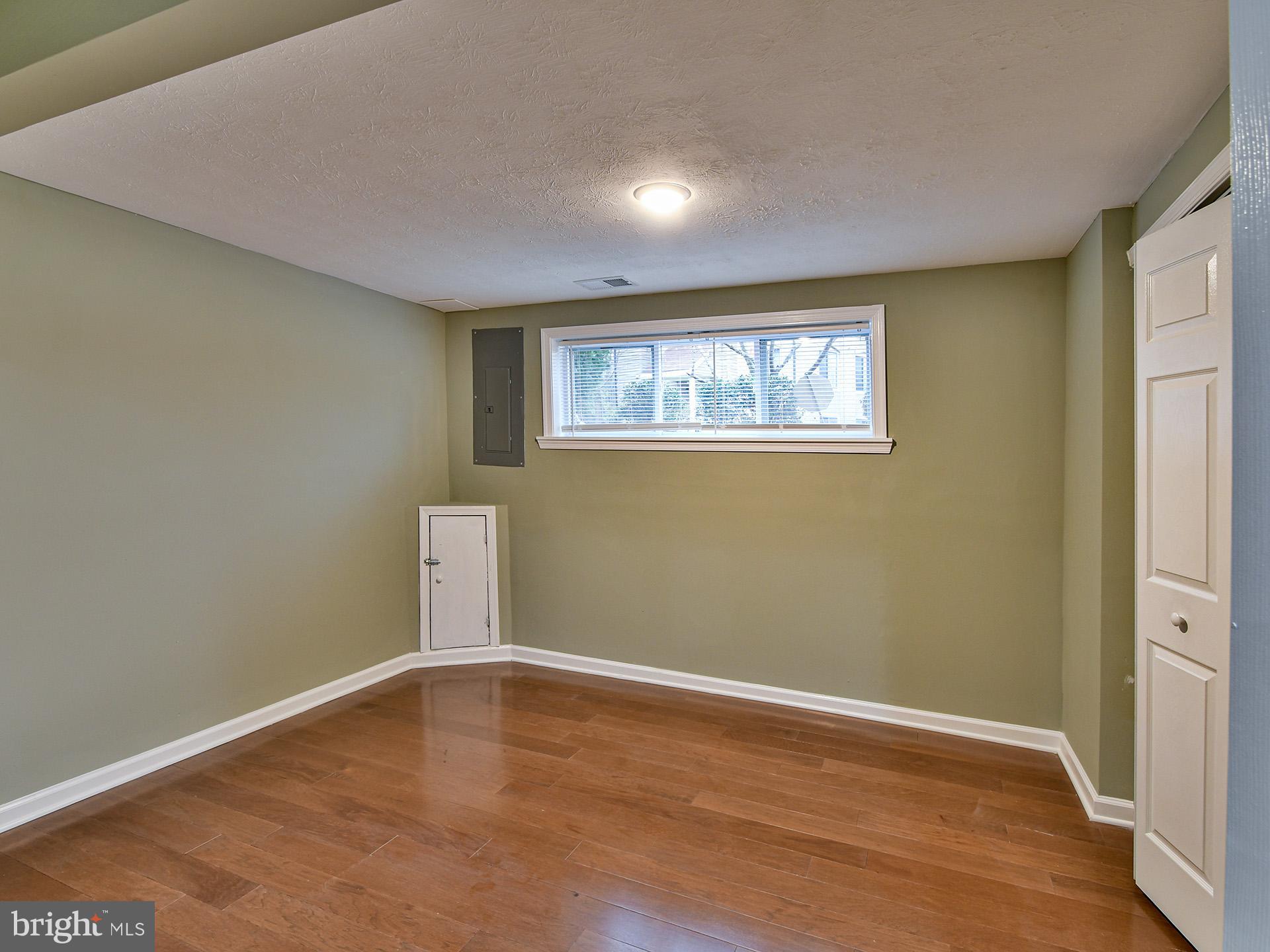3511 Castle Way, Unit 312 Silver Spring, MD 20904 - Photo 9 of 20 a view of empty room with wooden floor
