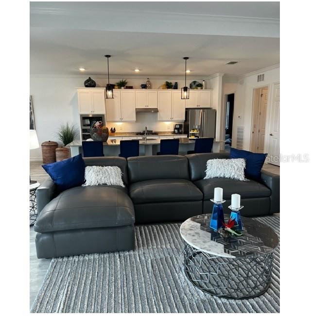 17021 Polo Trail Lakewood Ranch, FL 34211 - Photo 14 of 42 a living room with furniture and a couch