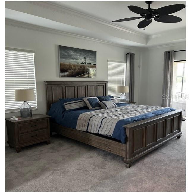 17021 Polo Trail Lakewood Ranch, FL 34211 - Photo 23 of 42 a bedroom with a bed and window