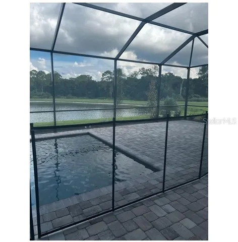 a bathroom with a glass shower door