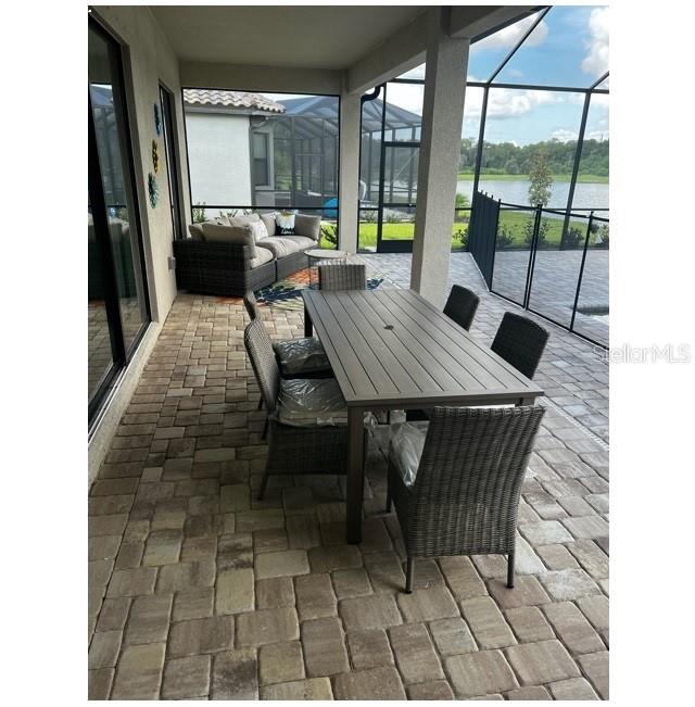 17021 Polo Trail Lakewood Ranch, FL 34211 - Photo 36 of 42 a view of a dining room with a table and chairs