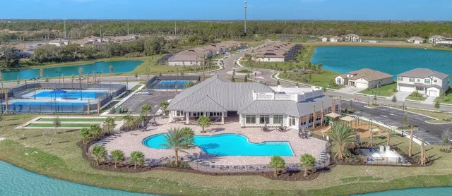 an aerial view of a house with a ocean view