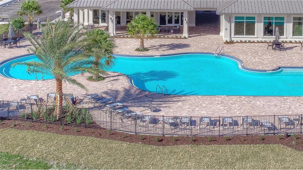 17021 Polo Trail Lakewood Ranch, FL 34211 - Photo 38 of 42 a view of a house with a yard and sitting area