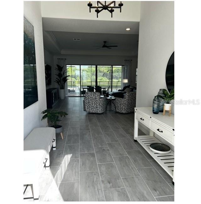 17021 Polo Trail Lakewood Ranch, FL 34211 - Photo 4 of 42 a living room with furniture and a large window