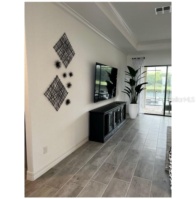 17021 Polo Trail Lakewood Ranch, FL 34211 - Photo 6 of 42 a living room with furniture and a flat screen tv