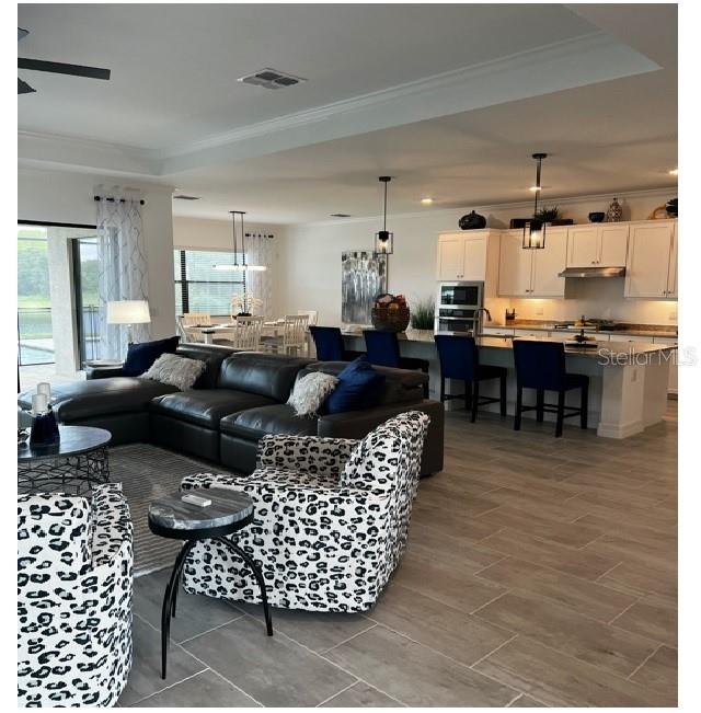 17021 Polo Trail Lakewood Ranch, FL 34211 - Photo 7 of 42 a living room with furniture