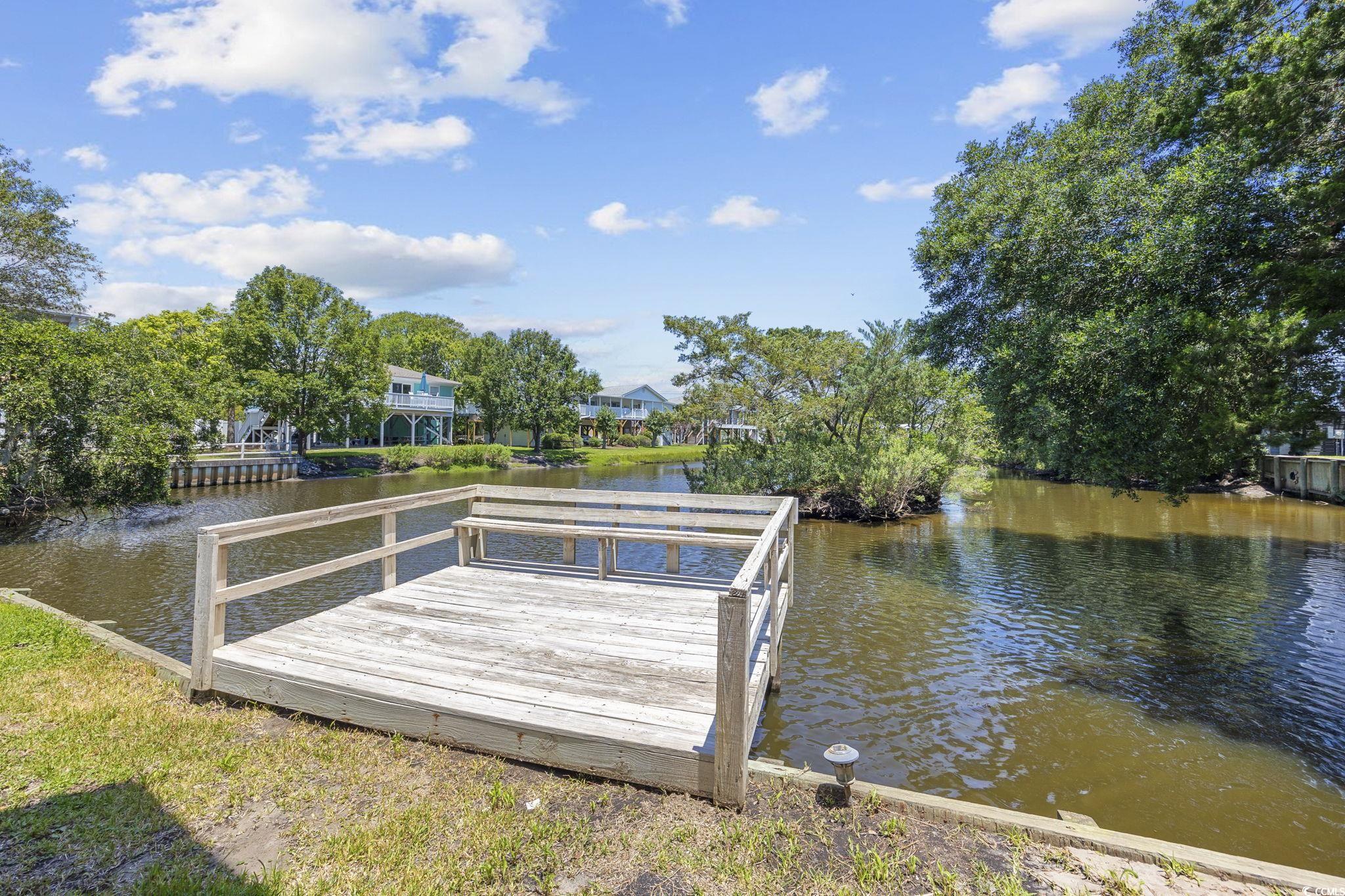 222 Calhoun Drive Murrells Inlet, SC 29576 - Photo 31 of 40 View of dock with a water view