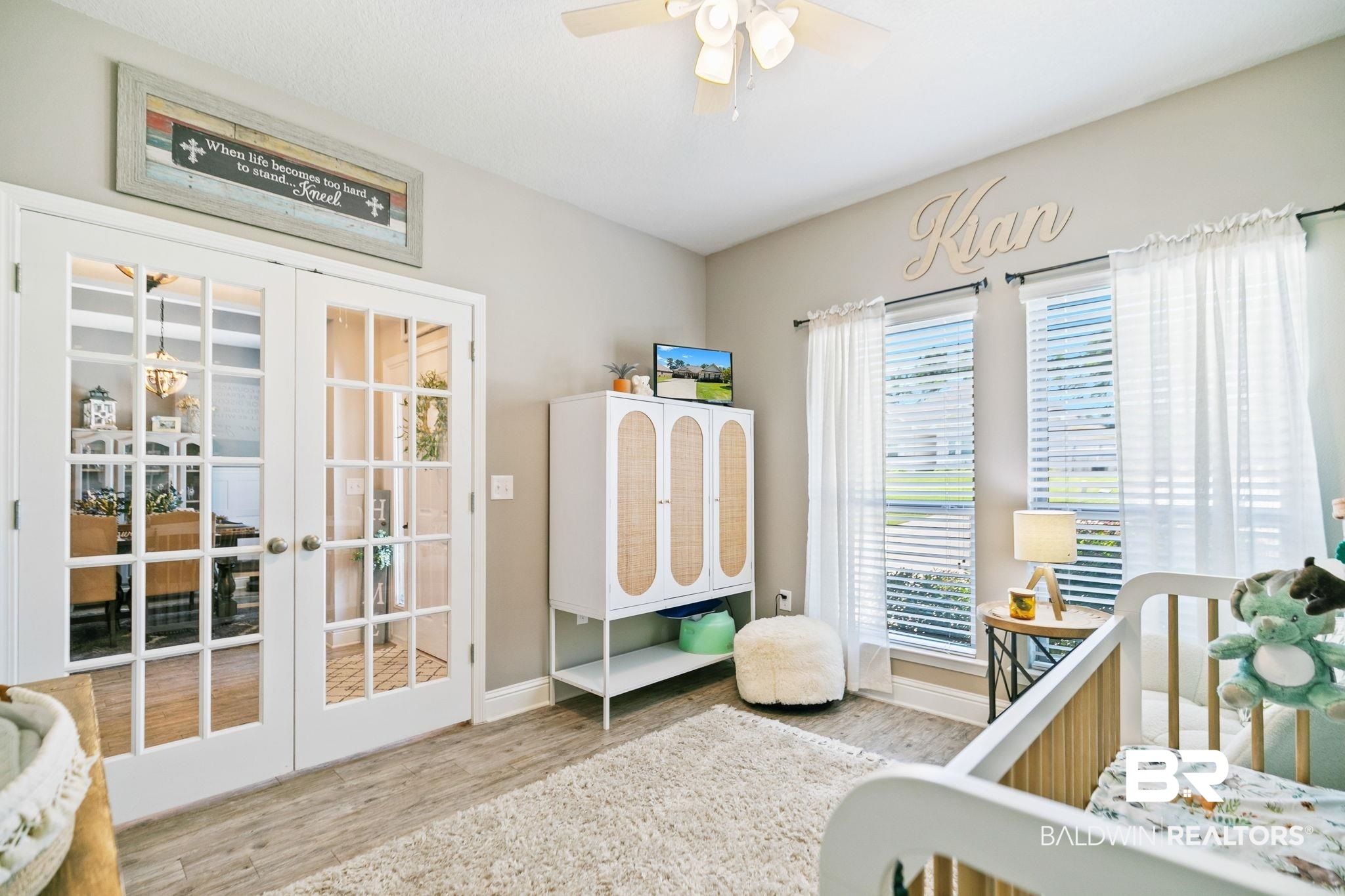 31402 Hoot Owl Road Daphne, AL 36527 - Photo 28 of 43 Bedroom featuring a nursery area, wood-type flooring, french doors, and ceiling fan