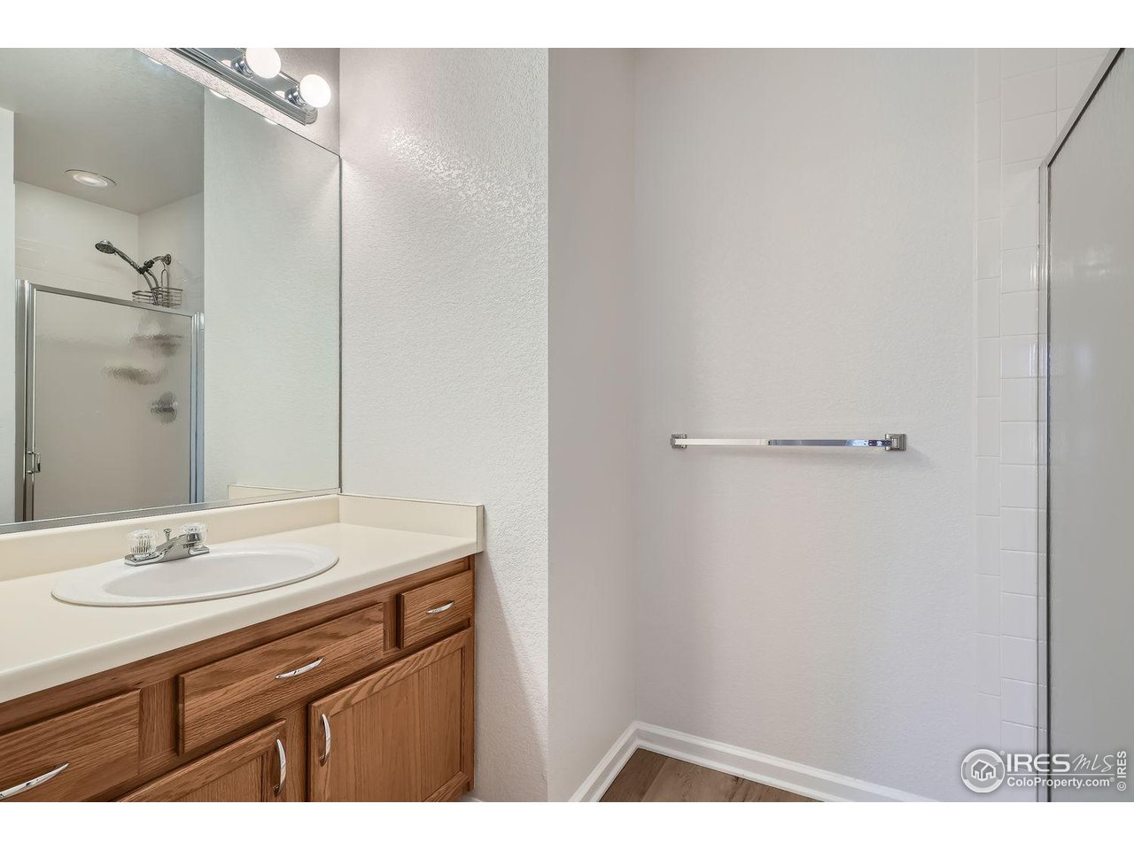 5091 Garrison Street, Unit 5 Wheat Ridge, CO 80033 - Photo 16 of 34 New flooring in bathrooms
