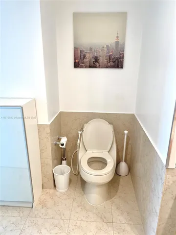 a bathroom with a toilet and a sink