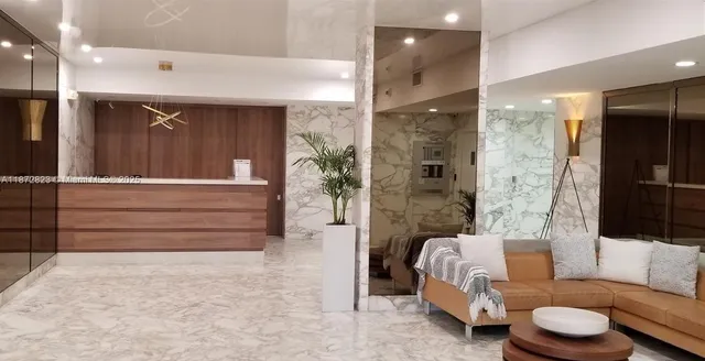 a bathroom with a tub shower and sink