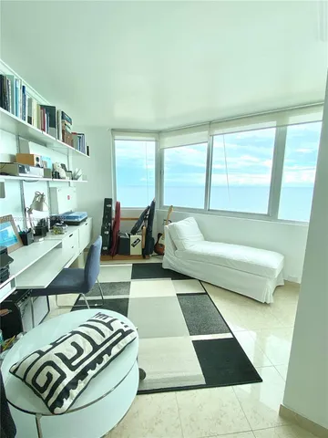 a living room with a bed and furniture