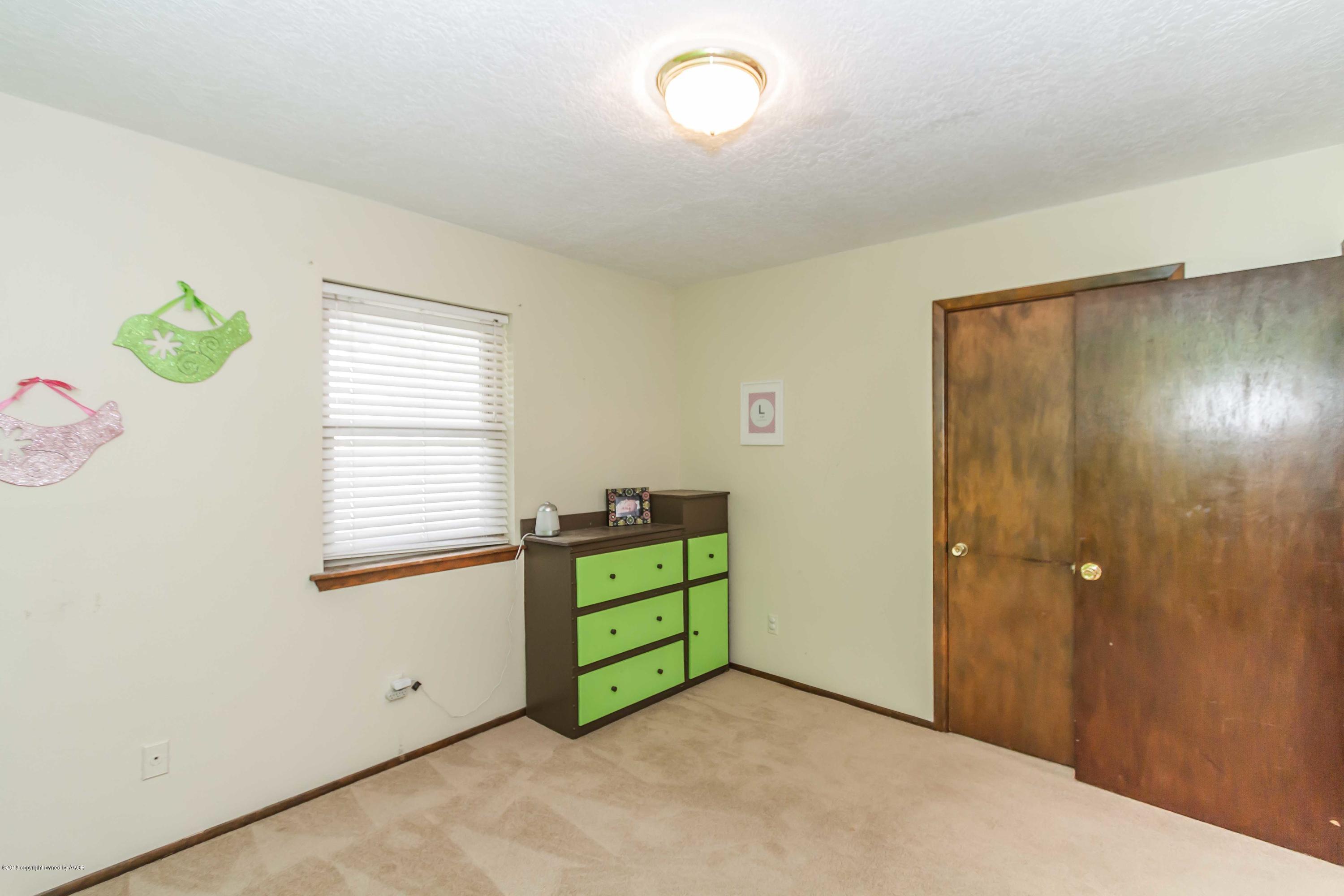 5205 South Milam Street Amarillo, TX 79110 - Photo 14 of 23 a view of room with window and closet