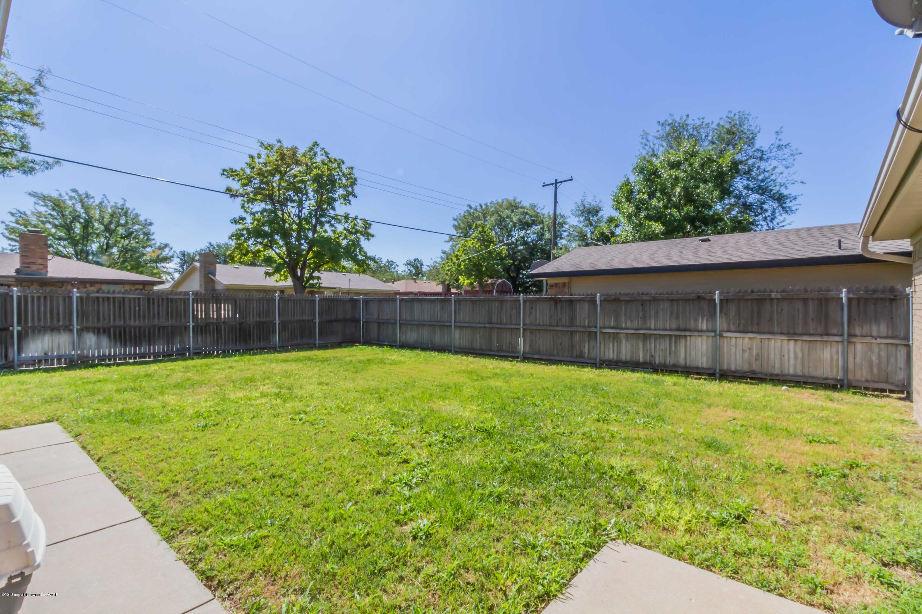 5205 South Milam Street Amarillo, TX 79110 - Photo 20 of 23 a view of a backyard with a small garden
