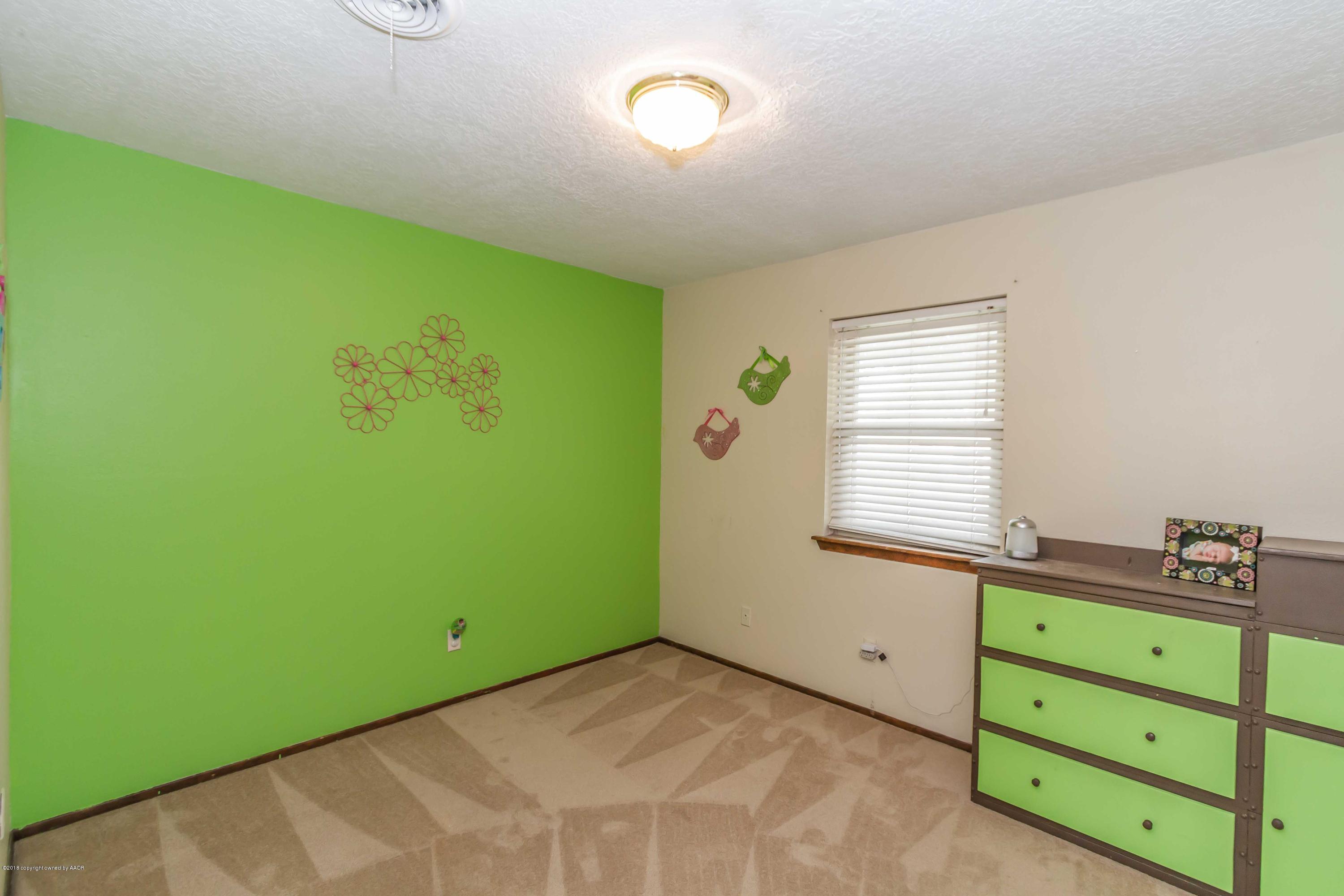 5205 South Milam Street Amarillo, TX 79110 - Photo 22 of 23 a view of a room with window and cabinet