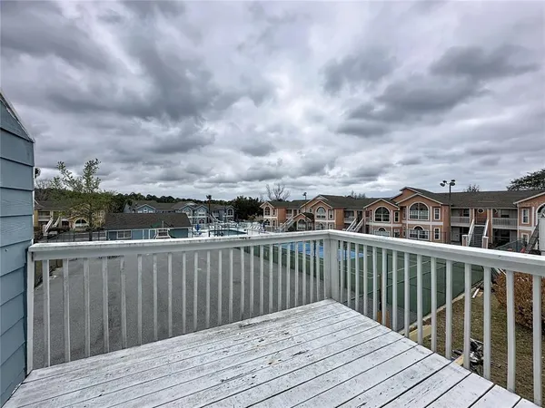 a view of a wooden roof with city view