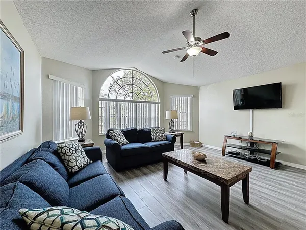 a living room with furniture and a flat screen tv