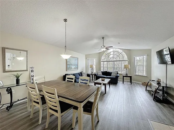 a view of a dining room with furniture window and wooden floor