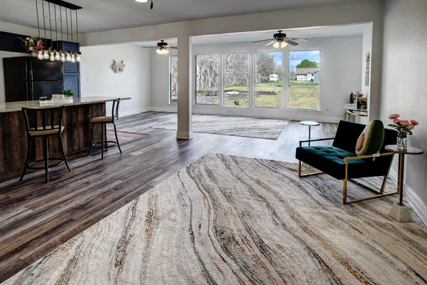 a living room with furniture and a large window