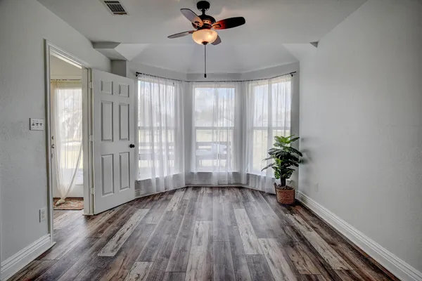 a view of an entryway with wooden floor
