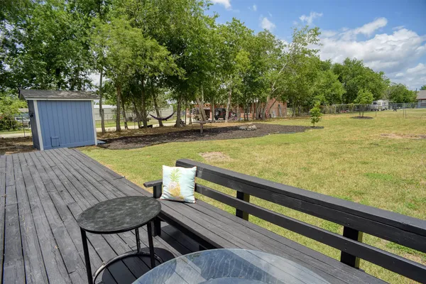 swimming pool view with a seating space