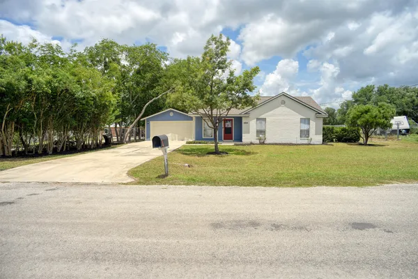 a house with trees in the background