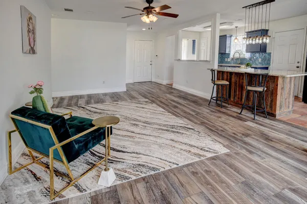 a work room with furniture and chandelier
