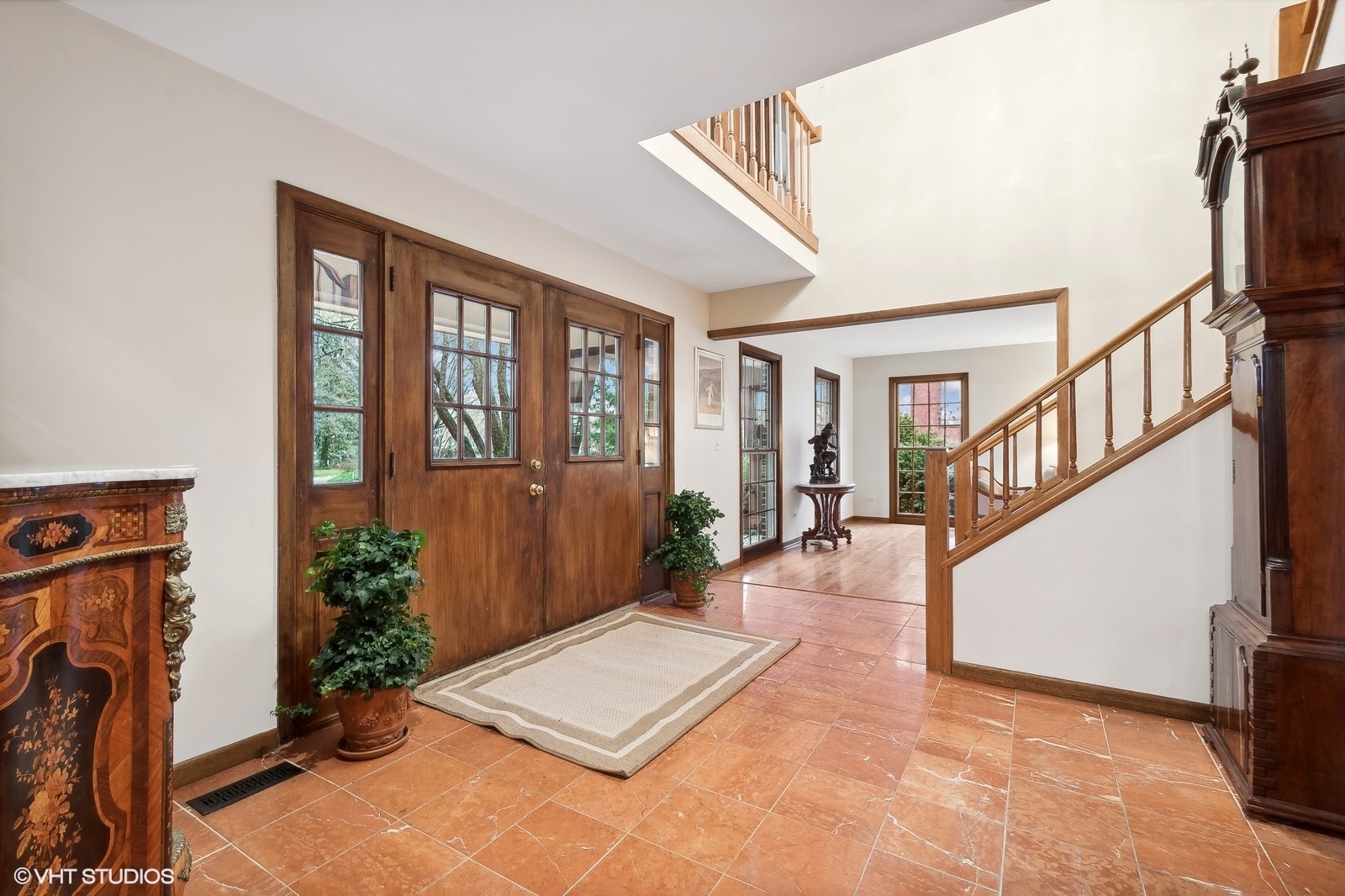 100 North Ridge Road Lake Forest, IL 60045 - Photo 3 of 32 a view of an entryway with wooden floor and door